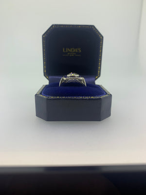 Platinum and Cushion Shaped Diamond Target Ring with Sapphire Surround