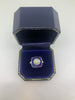 Platinum and Cushion Shaped Diamond Target Ring with Sapphire Surround